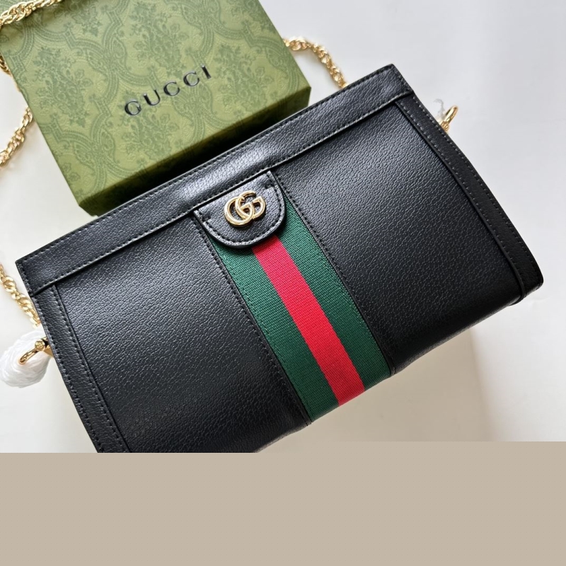 G*u*i clutch bags